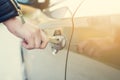 Woman with car key. Opening car door. WomanÃÂ´s hand unlocking a door on a car. Sunlight. Transportation. Royalty Free Stock Photo