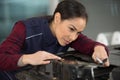 woman car mechanic conducts diagnostics Royalty Free Stock Photo