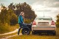 Woman on a car struck a wheel on the picturesque road.