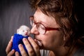 Woman care newborn white kitten in hands