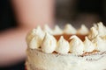 Woman Carefully Icing The Cake