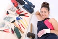 Woman carpenter with work tools