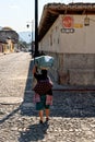 Woman carries a basket on her head - Antigua - Guatemala Royalty Free Stock Photo