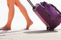 Woman carries your luggage at sandy beach Royalty Free Stock Photo