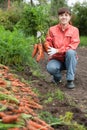 Woman with carrot harvest