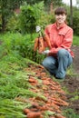 Woman with carrot harvest