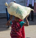 Woman Carry a Bag of Seed on Her Head in India