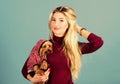 Woman carry yorkshire terrier. Girl attractive blonde hug cute dog. Apparel and accessories. Pet supplies. Dressing your