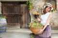 Woman carrying basket of grapes