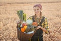 Woman carrying basket with healthy and locally produced vegetables Royalty Free Stock Photo