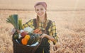 Woman carrying basket with healthy and locally produced vegetables Royalty Free Stock Photo