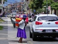 Woman is carrying big bucket, Ecuador