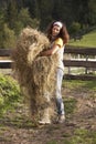 Woman carrying hay