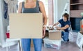 Woman carrying moving box Royalty Free Stock Photo