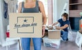 Woman carrying moving box Royalty Free Stock Photo