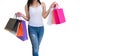 Woman carrying paper bags walking shopping white background