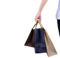 Woman carrying paper shopping bags isolated on white background. Royalty Free Stock Photo