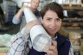 woman carrying papers in factory