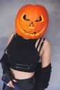 Woman with carved pumpkin on her head for Halloween Royalty Free Stock Photo