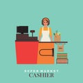 Woman cashier smiles and standing in supermarket.