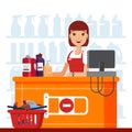 Woman cashier in supermarket with household chemicals. Seller at the counter, household supplies aisle, cleaning agents