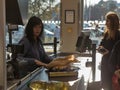 Woman cashier works in a Lidl supermarket in Kosice, Slovakia.