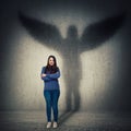 Woman casting angel shadow
