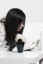 Woman in casual reading on couch closeup