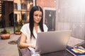 Woman in casual wear and glasses smart marketing coordinator having online training course via portable laptop computer