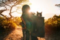 Woman with cat in backpack. Funny cat looks out of carrier bag. Travel with pets