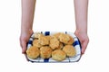 Woman is catch ceramic tray and a cookie is placed above. Royalty Free Stock Photo