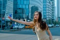 Woman catch taxicar. Hailing a taxi. Transport car. Get a ride.