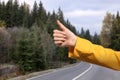 Woman catching car on road, closeup. Hitchhiking trip Royalty Free Stock Photo