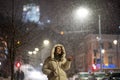 Woman catching snowflakes