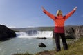 Woman Celebrating At Godafoss Waterfall, Iceland Royalty Free Stock Photo