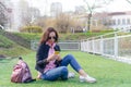 Woman with cellphone outdoors on the street. Woman using mobile smartphone. Royalty Free Stock Photo