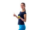 Woman with centimeter holding an apple and showing thumb up Royalty Free Stock Photo