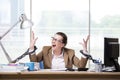 The woman chained to her working desk Royalty Free Stock Photo