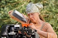 Woman changing engine oil Royalty Free Stock Photo