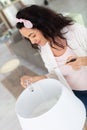 woman changing light bulb in lamp at home Royalty Free Stock Photo