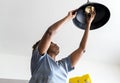 Woman changing lightbulb at home