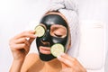 Woman with charcoal facial mask. Face skin care. Beauty treatments. Spa therapy Royalty Free Stock Photo