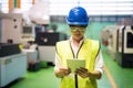 Woman check factory machine by tablet Royalty Free Stock Photo