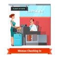 Woman checking in at the airport with clerk