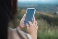 Woman is checking Bitcoin price chart on digital exchange on smartphone, cryptocurrency future price action prediction