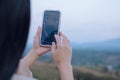 Woman is checking Bitcoin price chart on digital exchange on smartphone, cryptocurrency future price action prediction Royalty Free Stock Photo