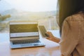 Woman is checking Bitcoin price chart on digital exchange on smartphone, cryptocurrency future price action prediction Royalty Free Stock Photo