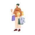 Woman checking Christmas shopping list, preparing for winter holiday. Happy girl holds Xmas gift box, bags with
