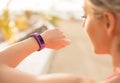 Woman checking fitness and health tracking wearable device Royalty Free Stock Photo