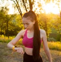 Woman checking fitness and health tracking wearable device Royalty Free Stock Photo